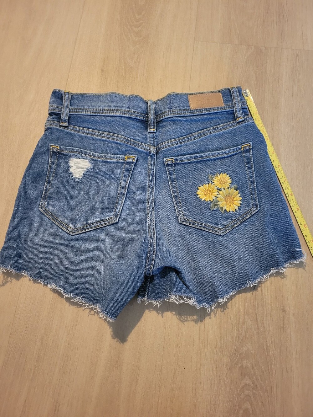 Hollister Blue Denim Cutoff Shorts with Yellow Sunflower Embroidery Size 1